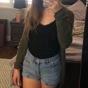 Green cardigan, butt length, thin but is cozy